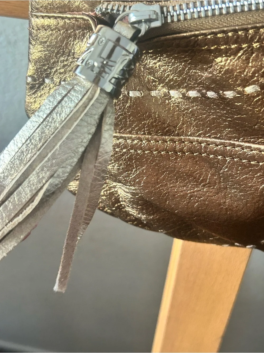 b. makowsky Metallic Gold Crossbody with Tassel Accent